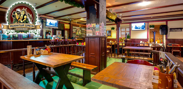 Любые блюда и напитки в ресторане «Мохнатый шмель»: рулька по-баварски, томленая баранья ножка в пряном соусе, стейк из нерки и не только! **Скидка 50%**